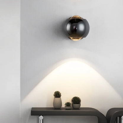 Orbis LED-wandlamp – draaibare bolvormige lamp in zwart met 360° lichtuitlijning