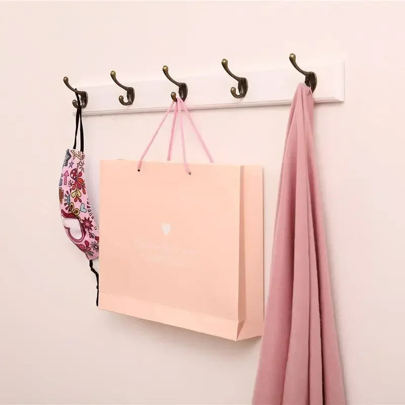 Wandgarderobe aus Massivholz mit Haken für Jacken & Hüte